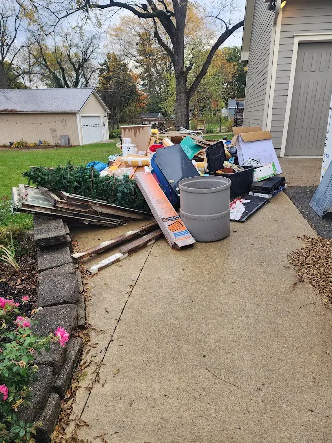 Dumpster being loaded with debris for 3 Yard Dumpster Rental in Elbridge